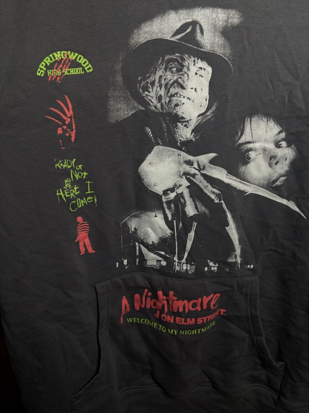 A Nightmare on Elm Street Black Graphic Hoodie with Red & Green Accents